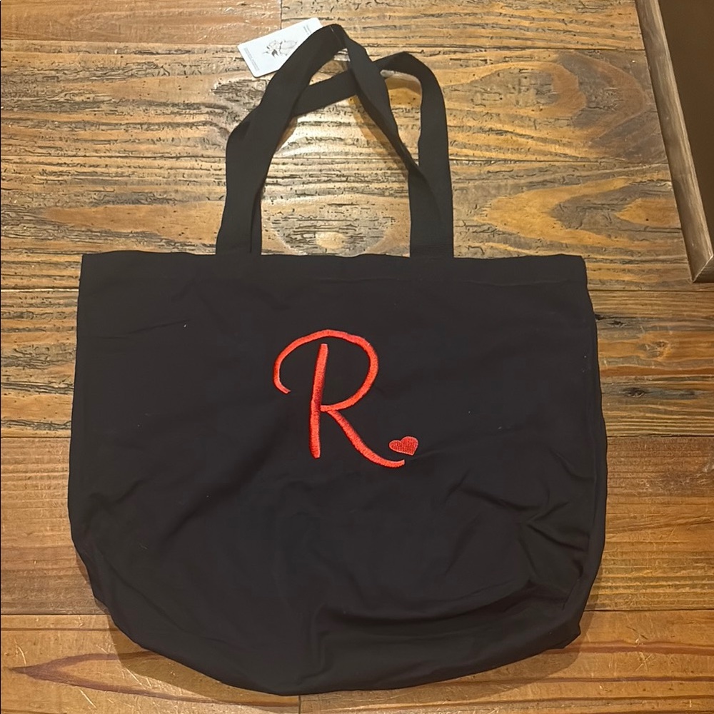Black canvas tote bag with R initial